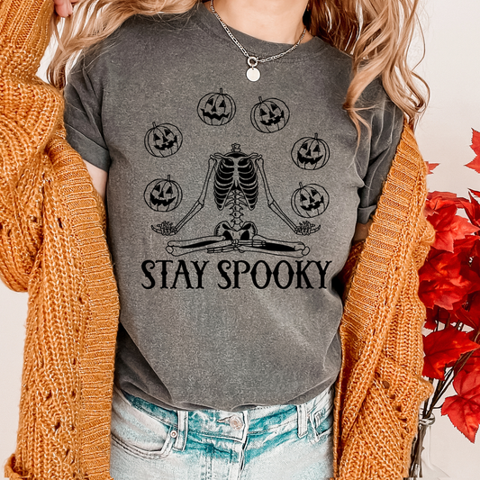 Introducing our "Stay Spooky" t-shirt! This shirt is perfect for those who love Halloween or just enjoy a touch of spookiness in their style. Made with high-quality materials, this shirt is comfortable to wear and will last for years to come. The design features bold, eye-catching text that will make a statement wherever you go. Available in a variety of sizes and colors. Get yours today and add a touch of spookiness to your wardrobe! Available in Sizes Small-3XL. 